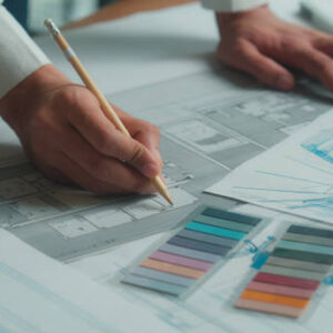 Indian business man designer architect engineer constructor drawing building plan sketch construction blueprint on desk male female team coworkers muslim women discuss architecture project in office. High quality 4k footage